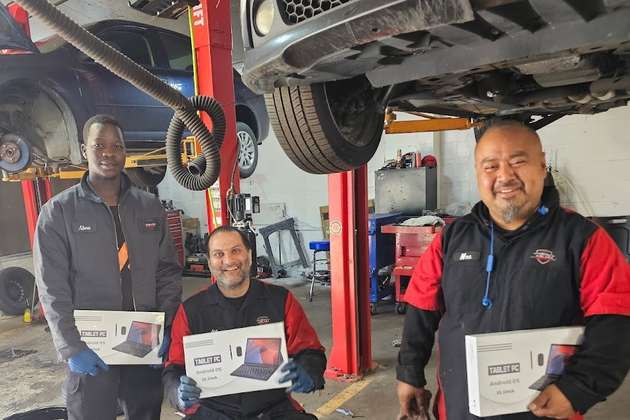 Technicians at the Budget Auto Fix repair shop